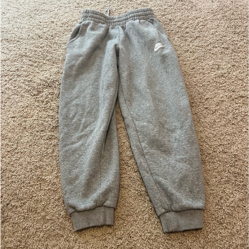 Grey Nike sweatpants. From pet friendly home